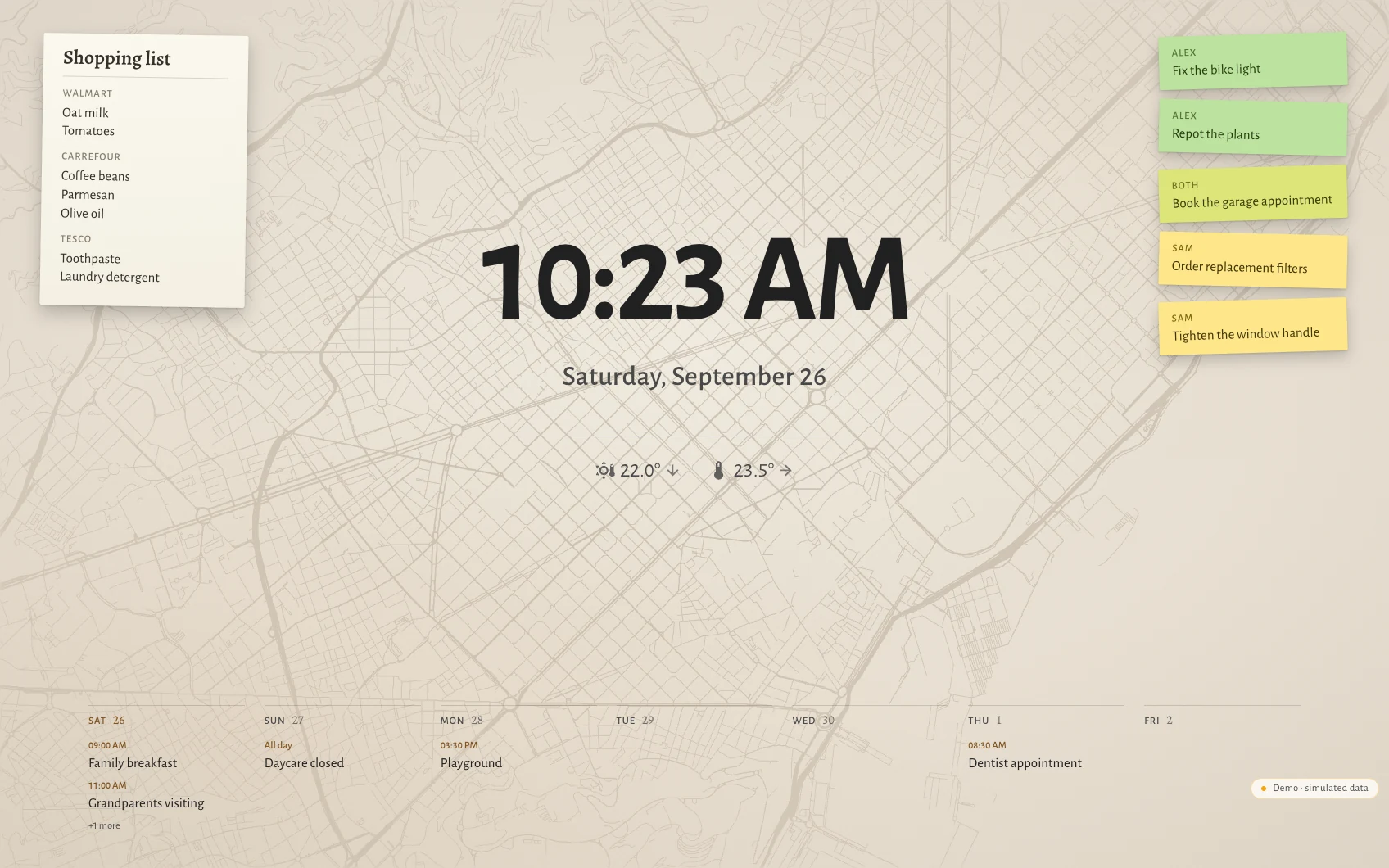 The Hauser standby screen by day in Barcelona: clock, date, the week as seven columns along the bottom, post-its and the shopping list over a faint street map showing the Eixample grid cut by the Diagonal.